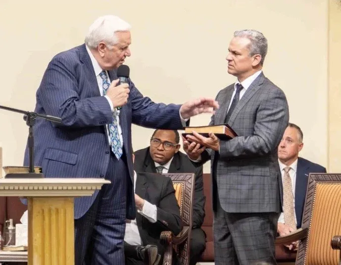 Pastor Ryan Gregg preaching at the pulpit during worship at Fortress of Truth Apostolic Church in Visalia, California
